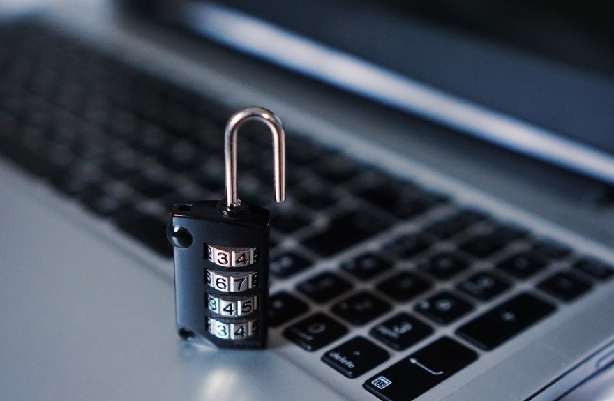 hand lock sitting on computer keyboard